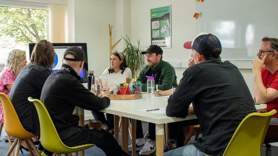 a group of people sitting around a table